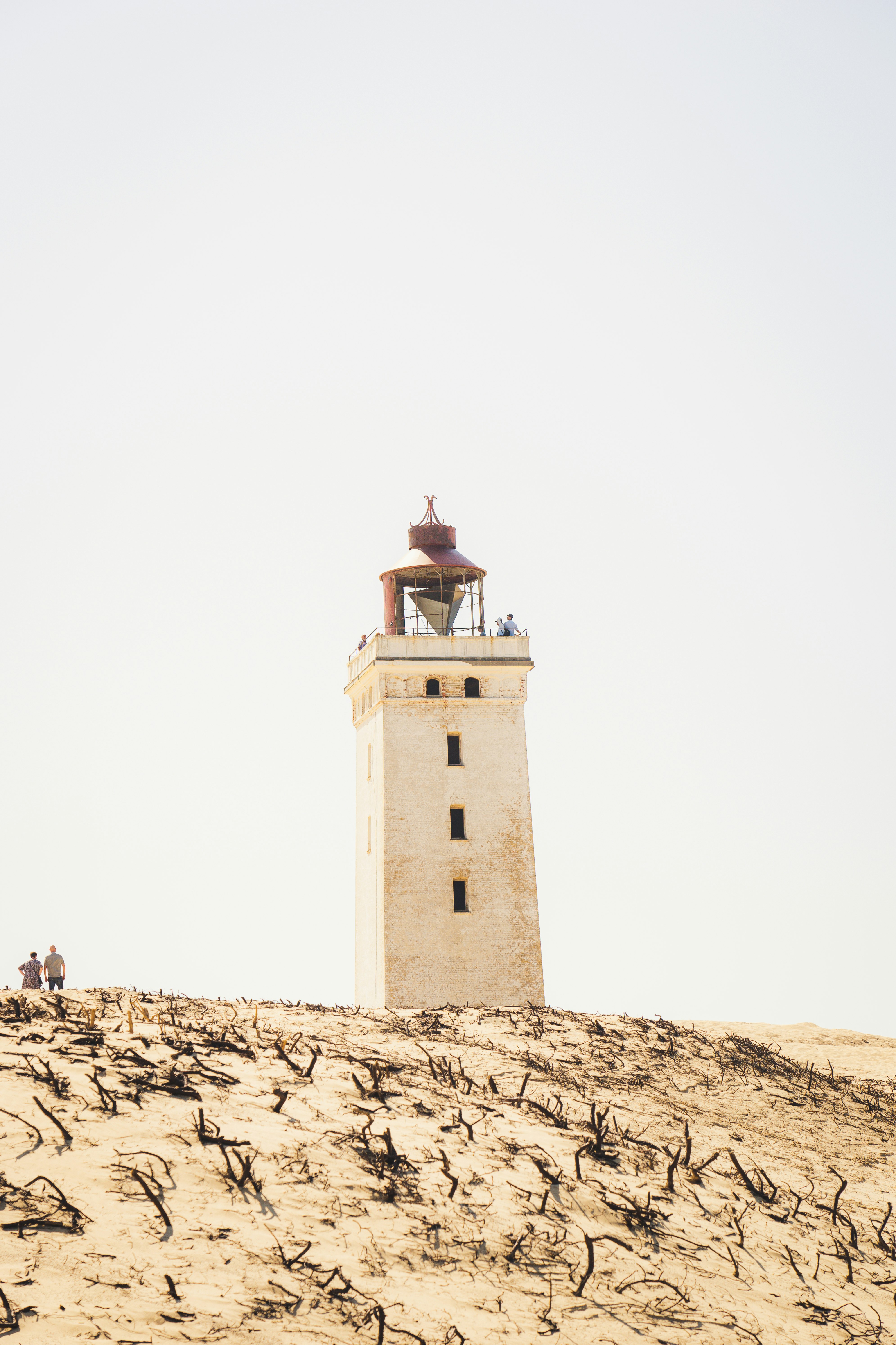 people walking on brown concrete tower during daytime